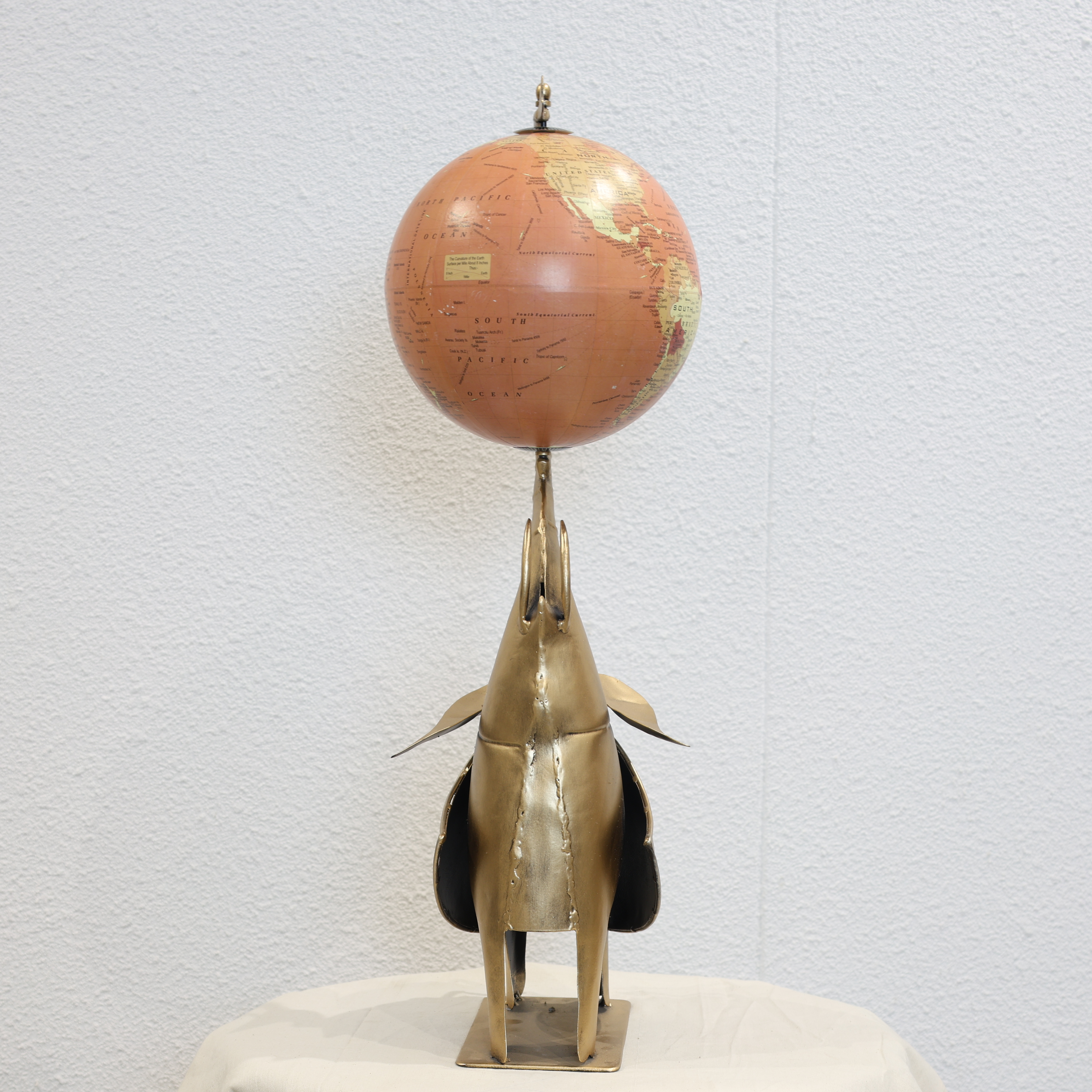 Globe Holding Elephant Sculpture