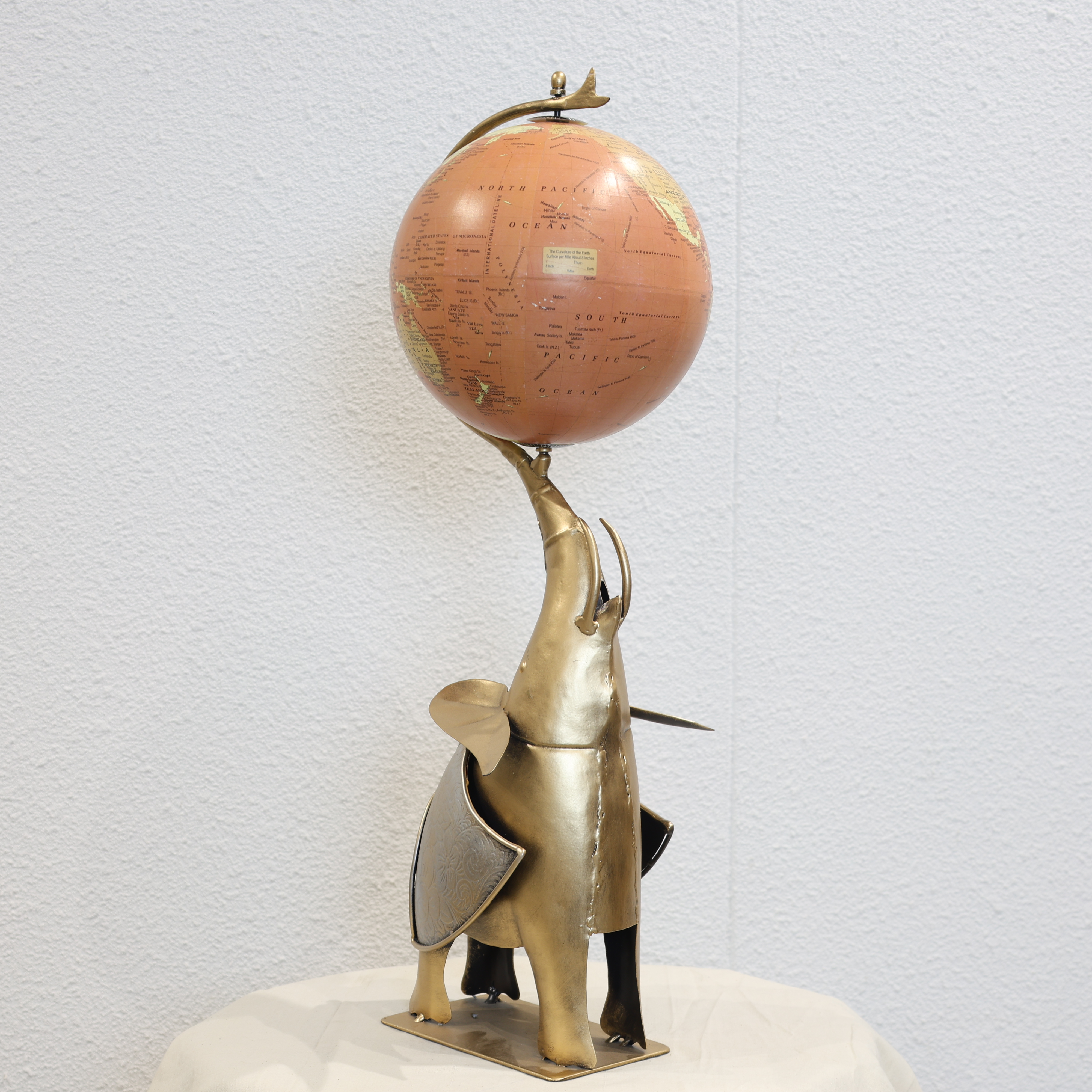 Globe Holding Elephant Sculpture