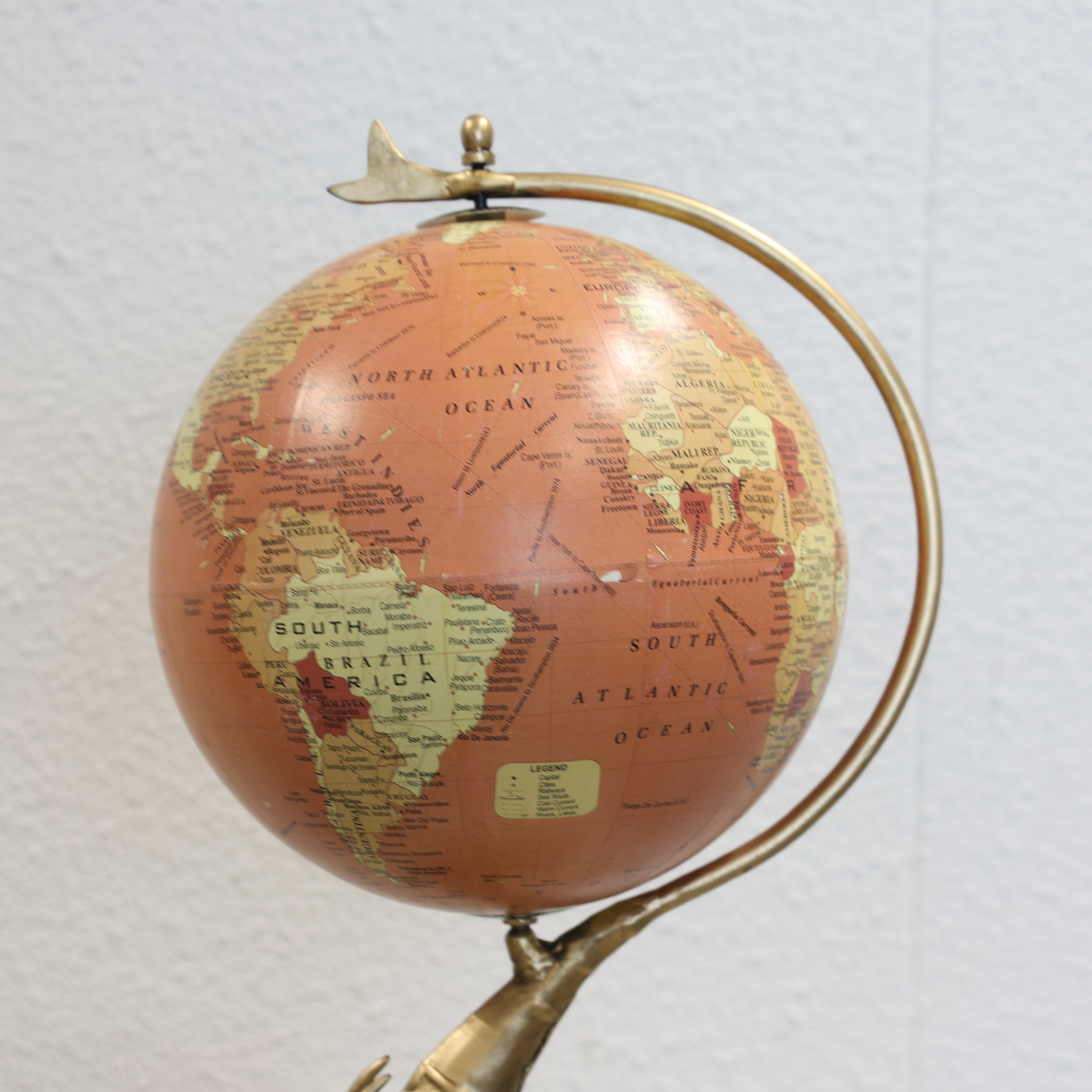 Globe Holding Elephant Sculpture