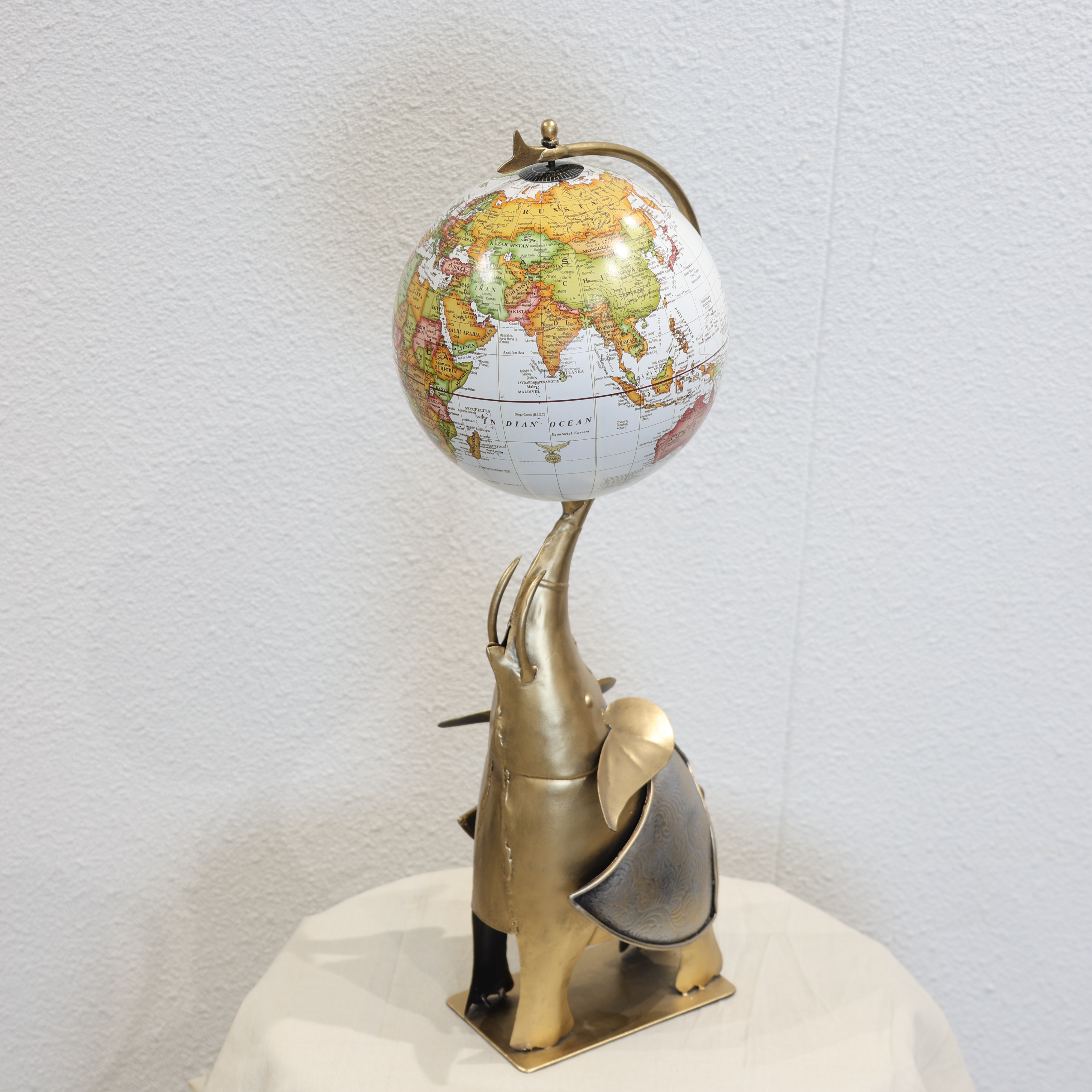 Globe Holding Elephant Showpiece