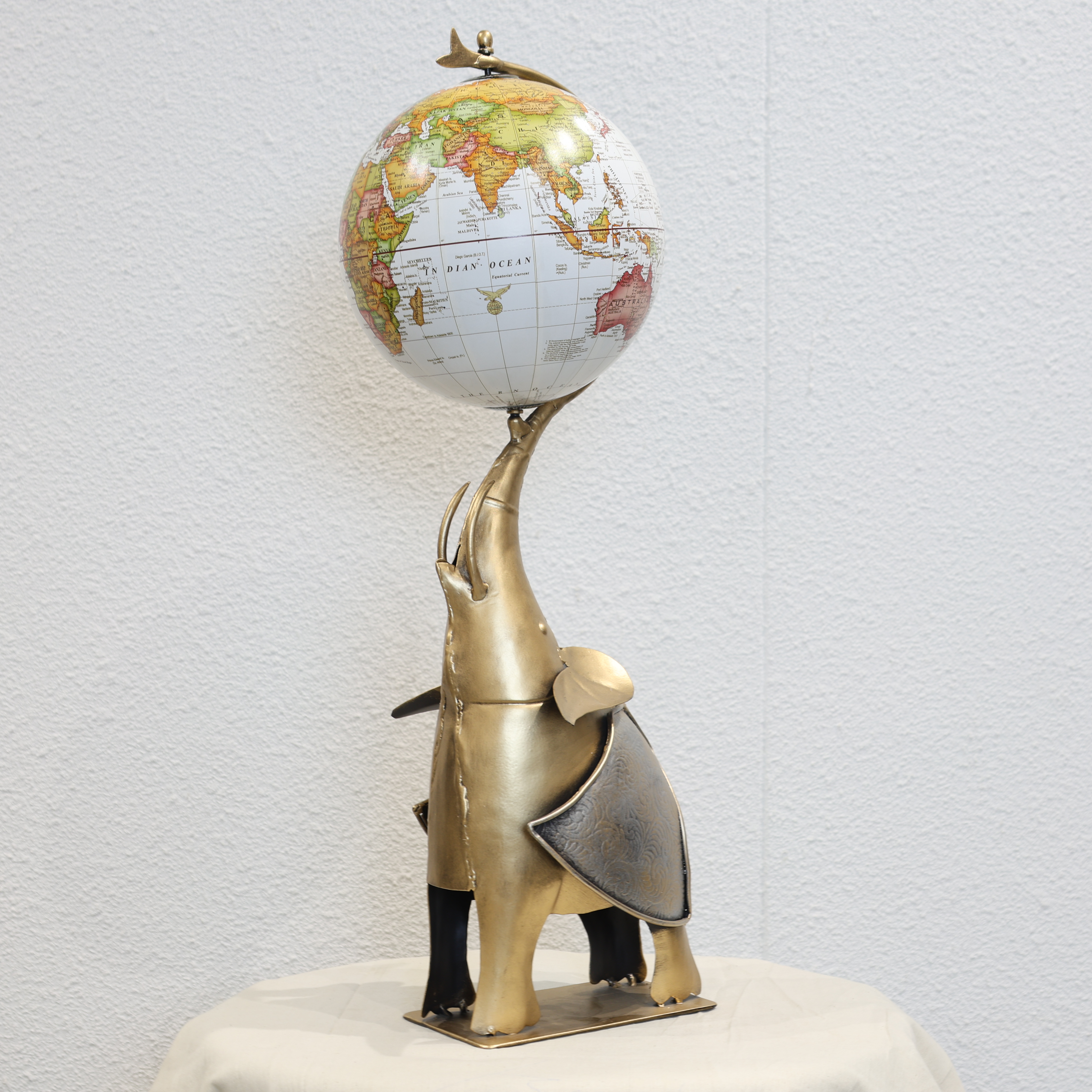 Globe Holding Elephant Showpiece