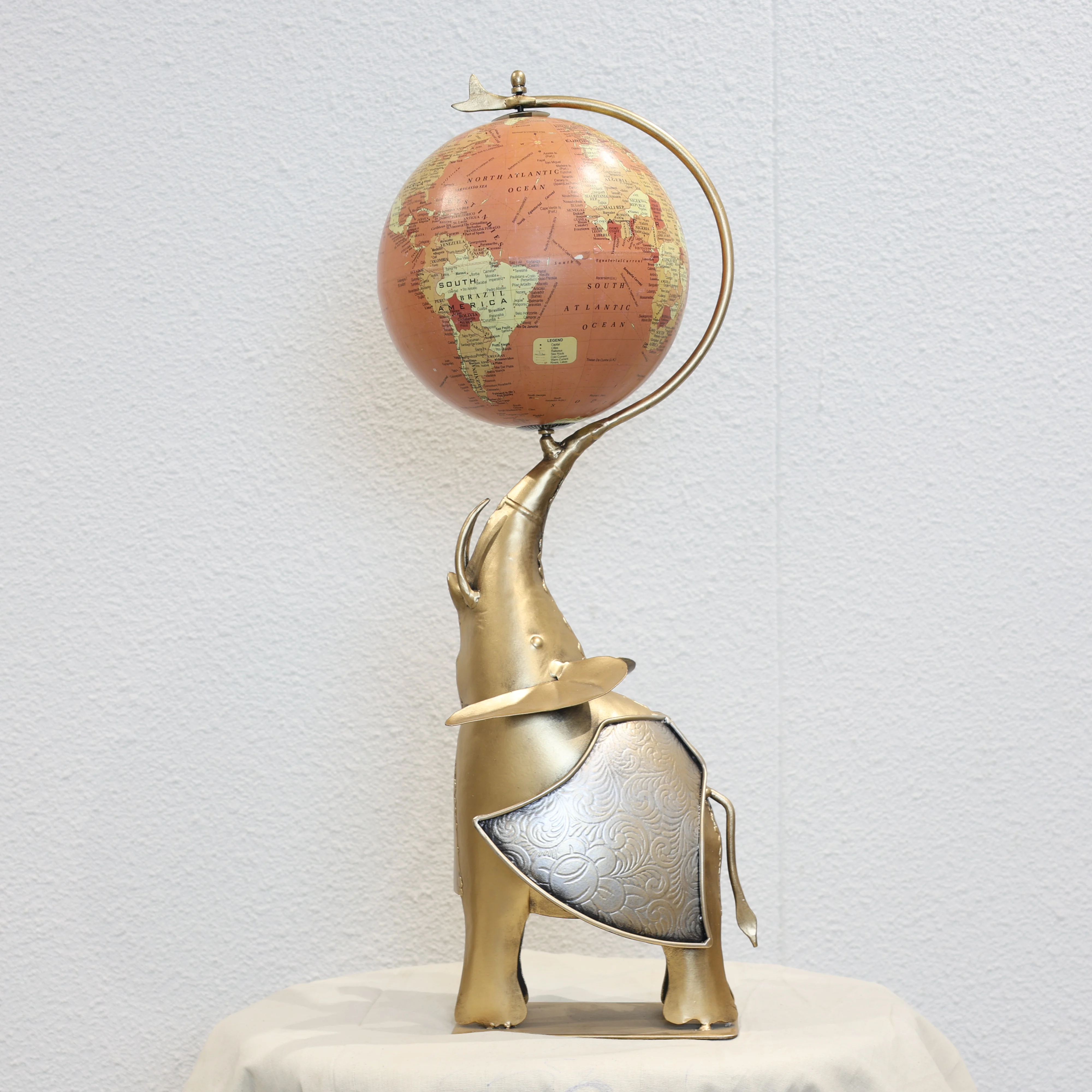 Globe Holding Elephant Sculpture