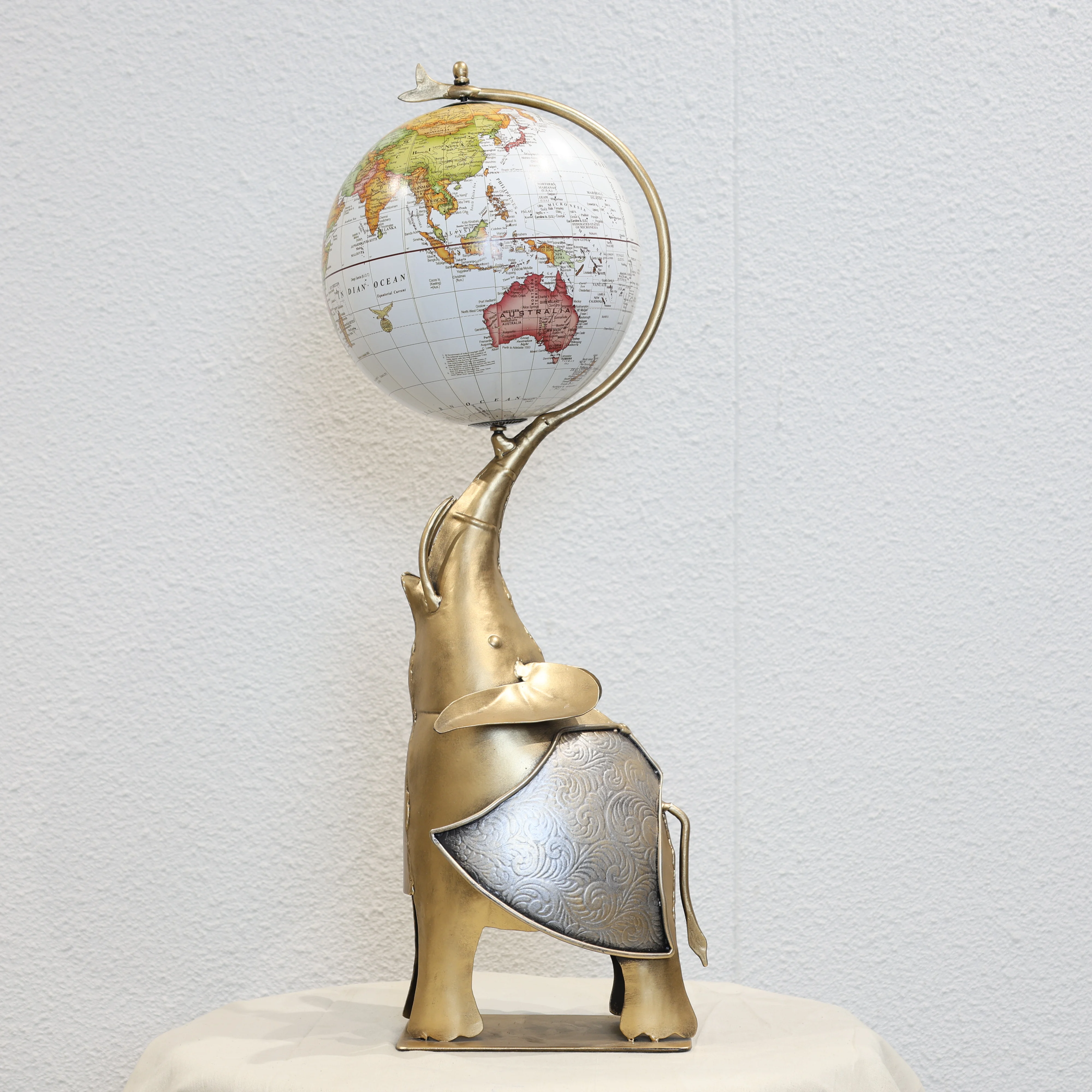 Globe Holding Elephant Showpiece